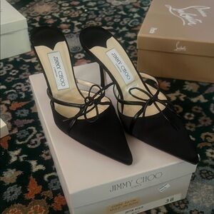 Jimmy Choo Black Heels with Slingback Design